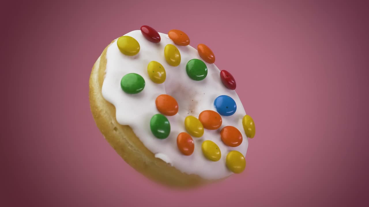 Stock Video Donut With Icing Chocolates Rotating On A Pink Background Live Wallpaper For PC