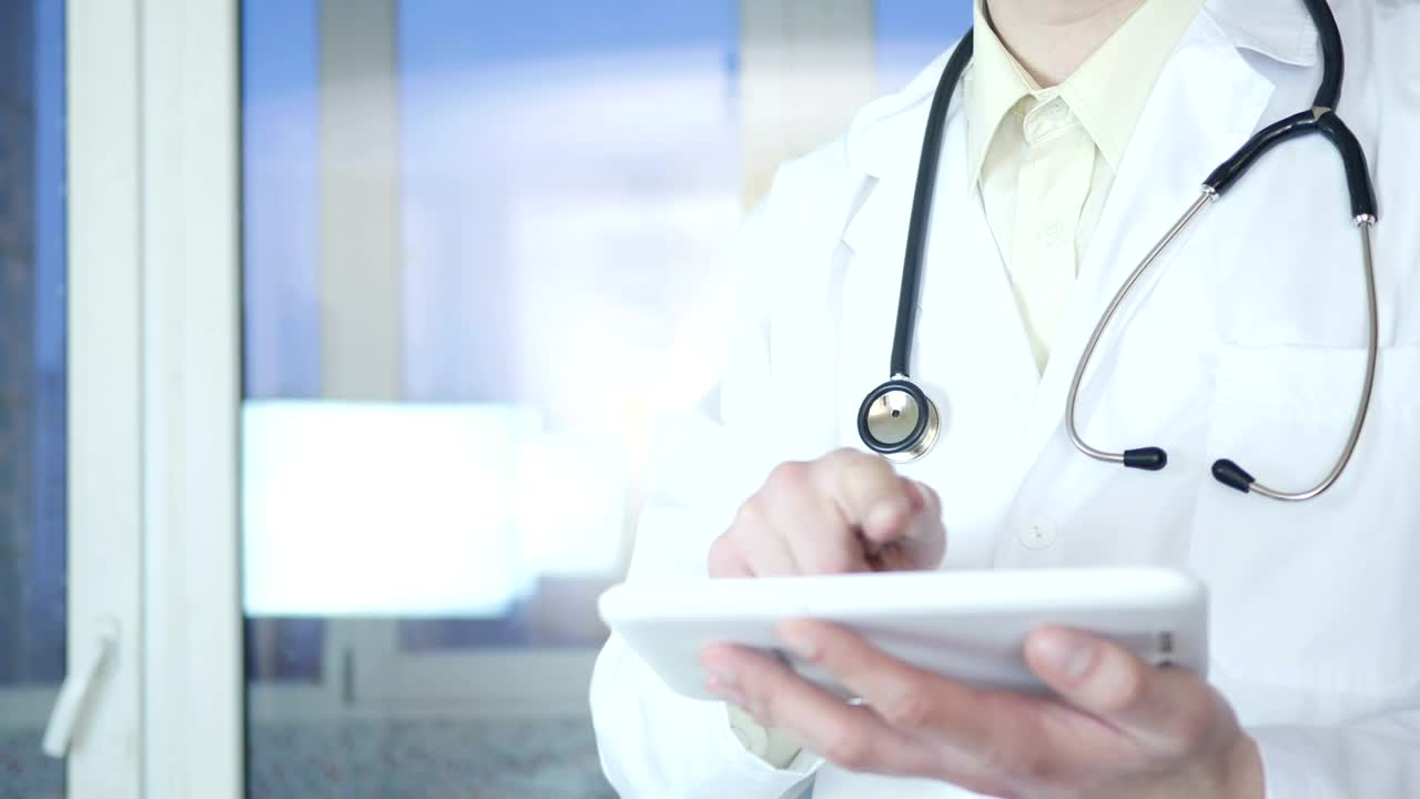 Stock Video Doctor Working On A Tablet Device Live Wallpaper For PC