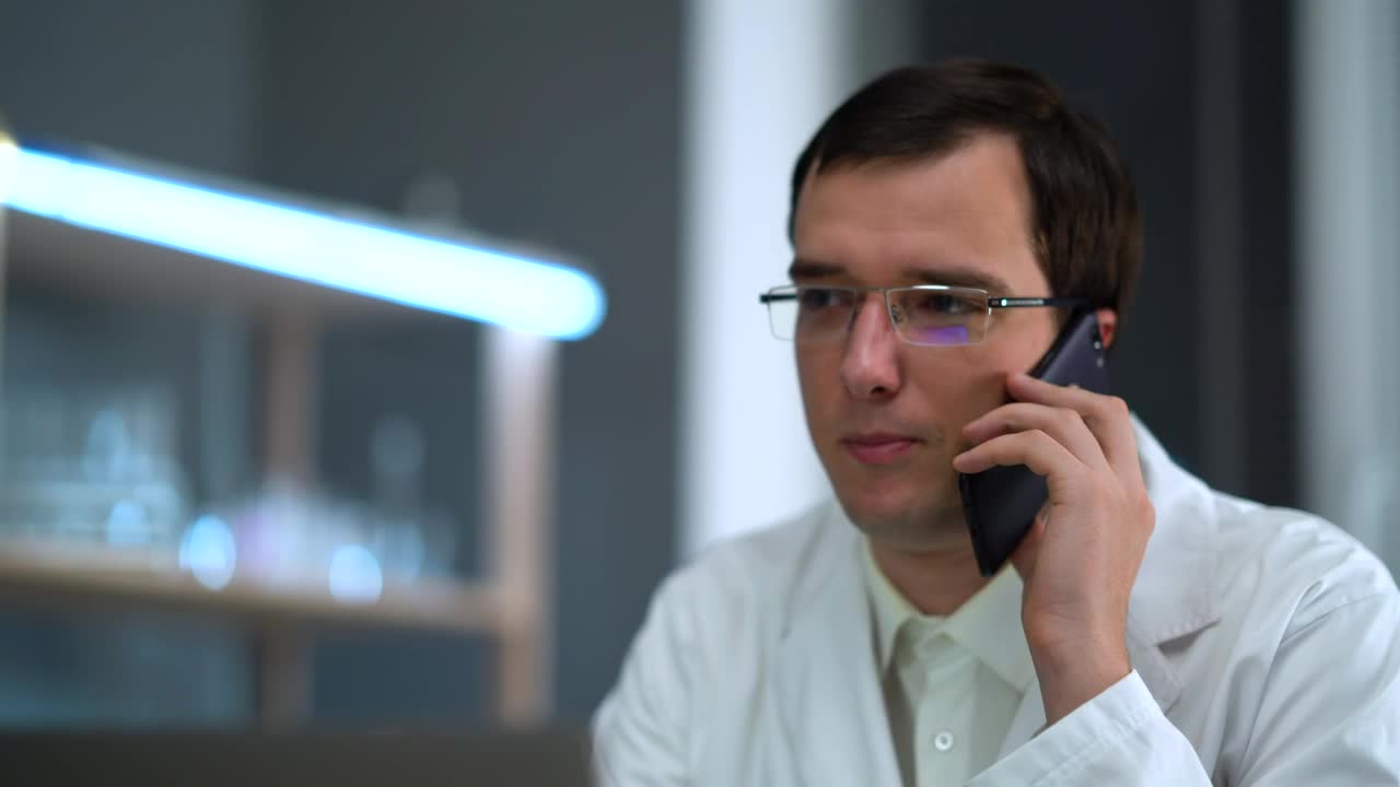 Stock Video Doctor With Glasses Talking On The Phone Live Wallpaper For PC