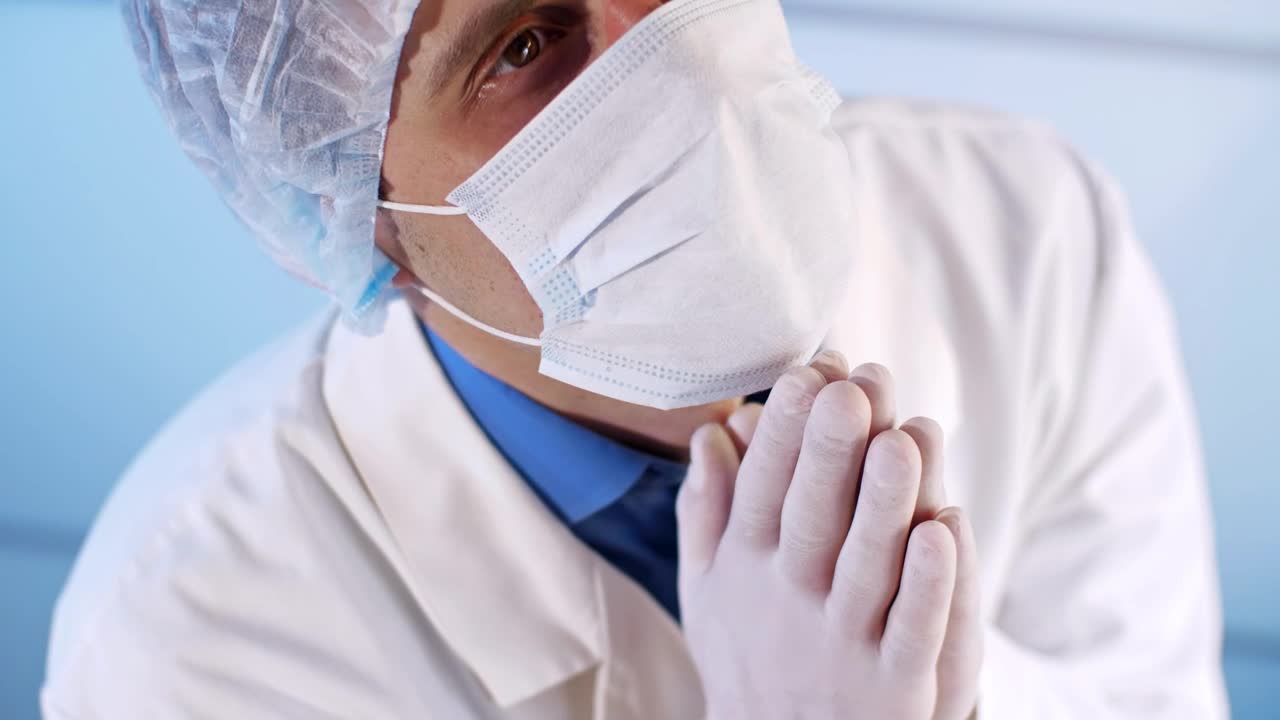 Stock Video Doctor With Face Mask Praying To Heaven Live Wallpaper For PC