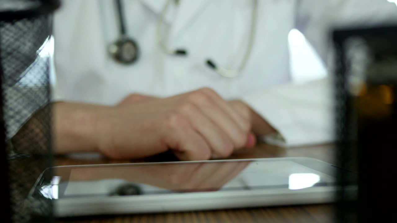 Stock Video Doctor Typing On A Tablet In The Desk Live Wallpaper For PC
