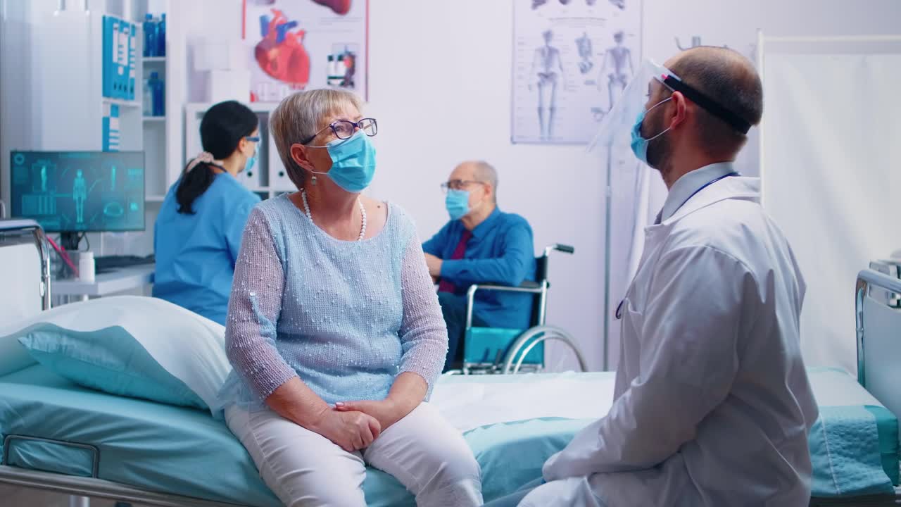 Stock Video Doctor Talking To His Patient In Hospital Live Wallpaper For PC