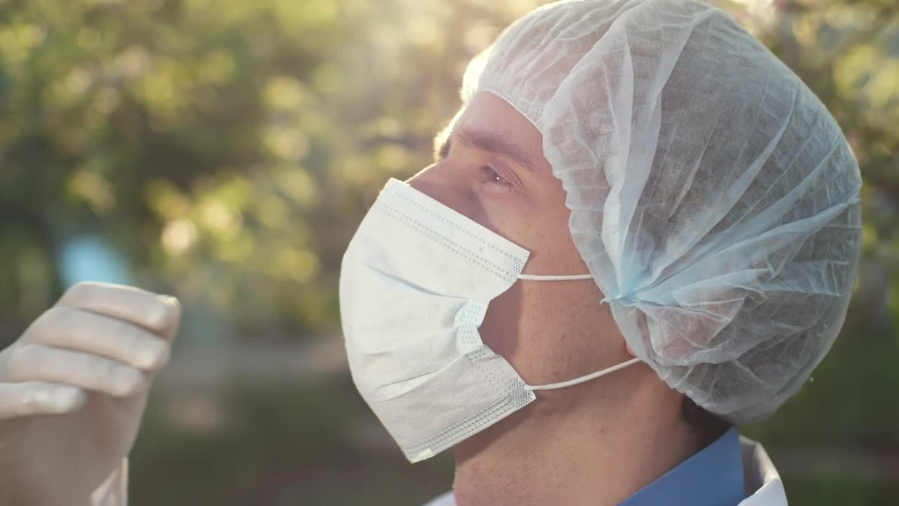 Stock Video Doctor Taking Off His Mask And Sighing Live Wallpaper For PC