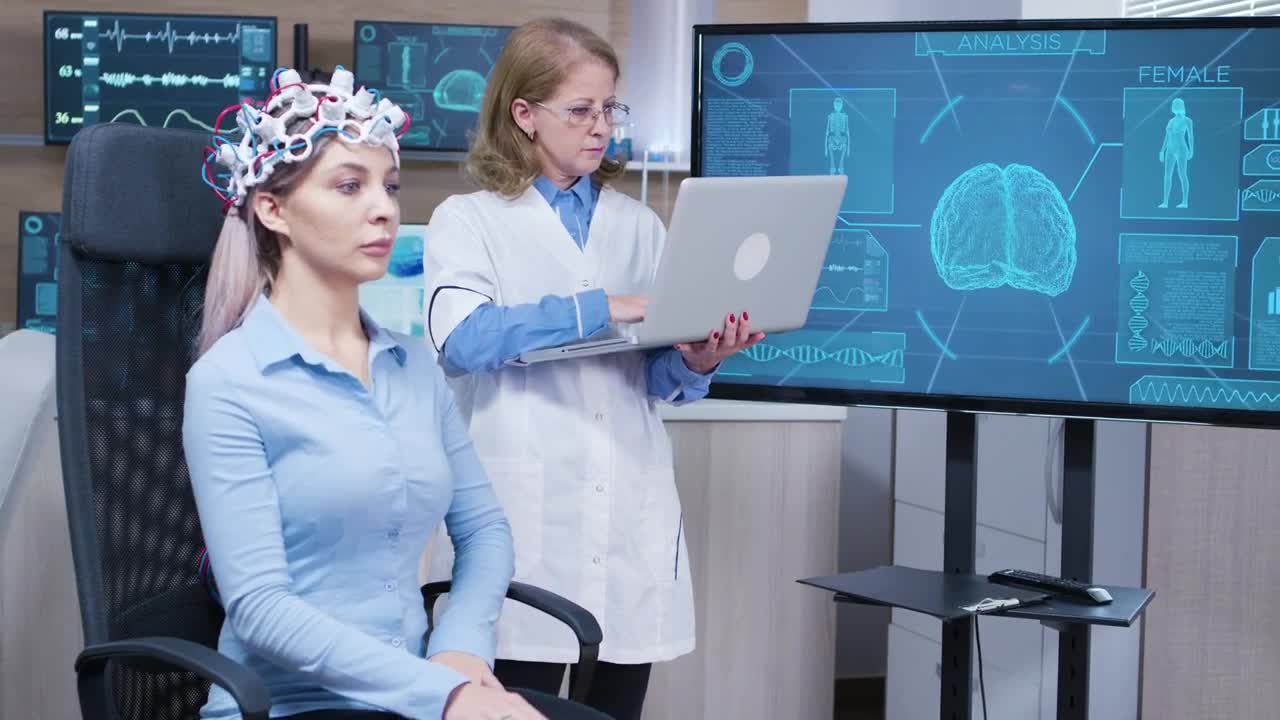 Stock Video Doctor Studies Patient Brain Scan And Types On Laptop Live Wallpaper For PC