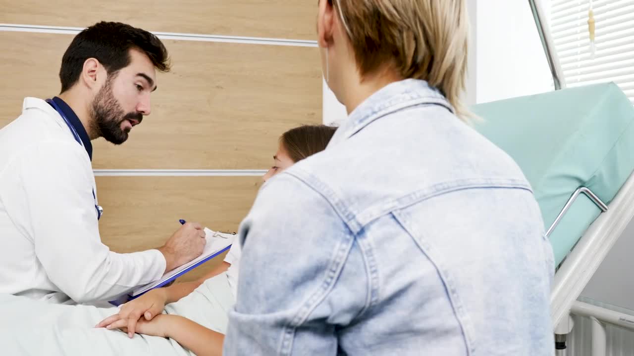Stock Video Doctor Questions Young Girl On Hospital Bed Live Wallpaper For PC
