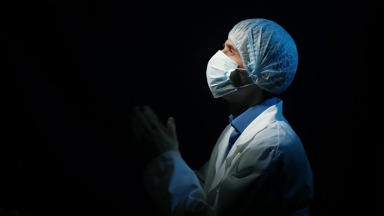 Stock Video Doctor Praying In A Dark Room Looking At Sky Live Wallpaper For PC