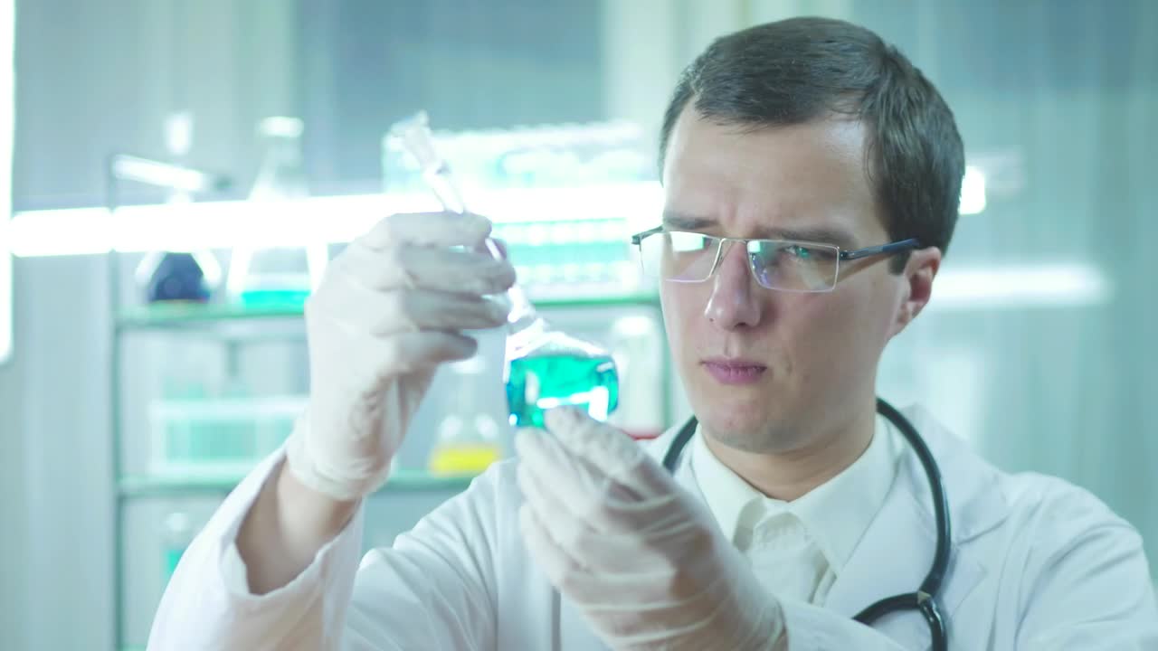 Stock Video Doctor Looking To A Flask With Blue Liquid Live Wallpaper For PC