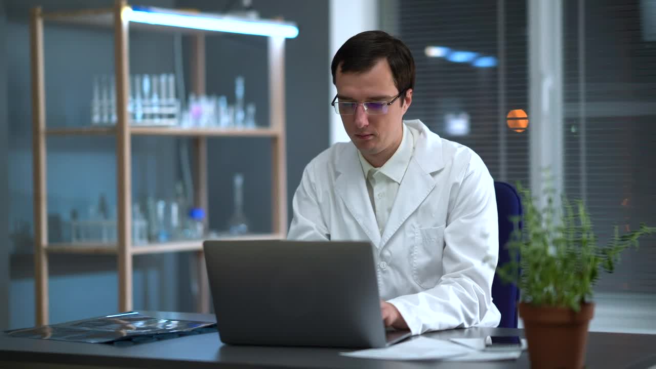 Stock Video Doctor Looking At An X Ray And Working On The Computer Live Wallpaper For PC