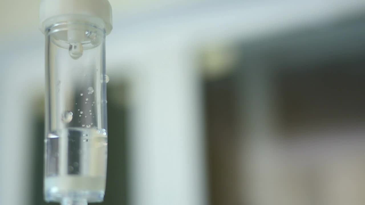 Stock Video Doctor In A Mask Checks An Iv Dispenser Live Wallpaper For PC