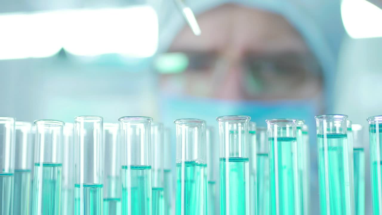 Stock Video Doctor Extracting Liquid From The Lab Tubes Live Wallpaper For PC