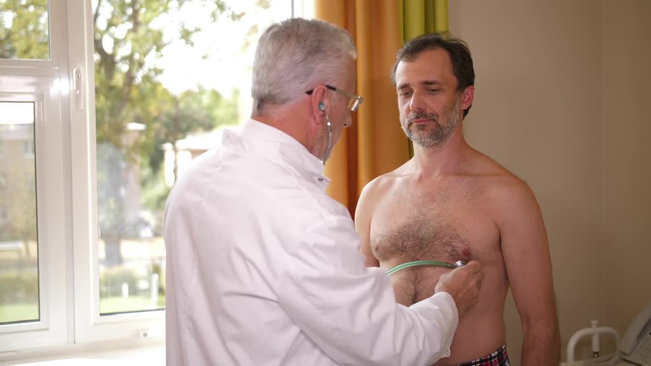Stock Video Doctor Examining A Male Patient Live Wallpaper For PC