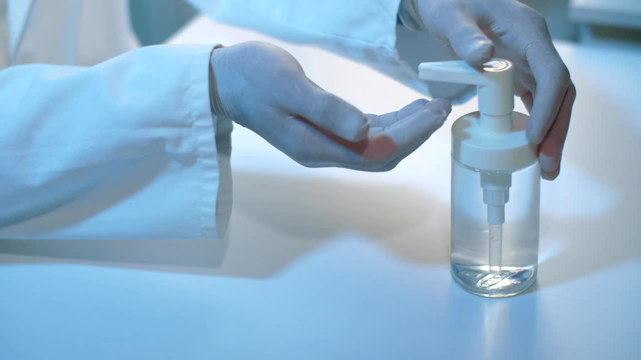 Stock Video Doctor Disinfecting His Surgical Gloves Live Wallpaper For PC