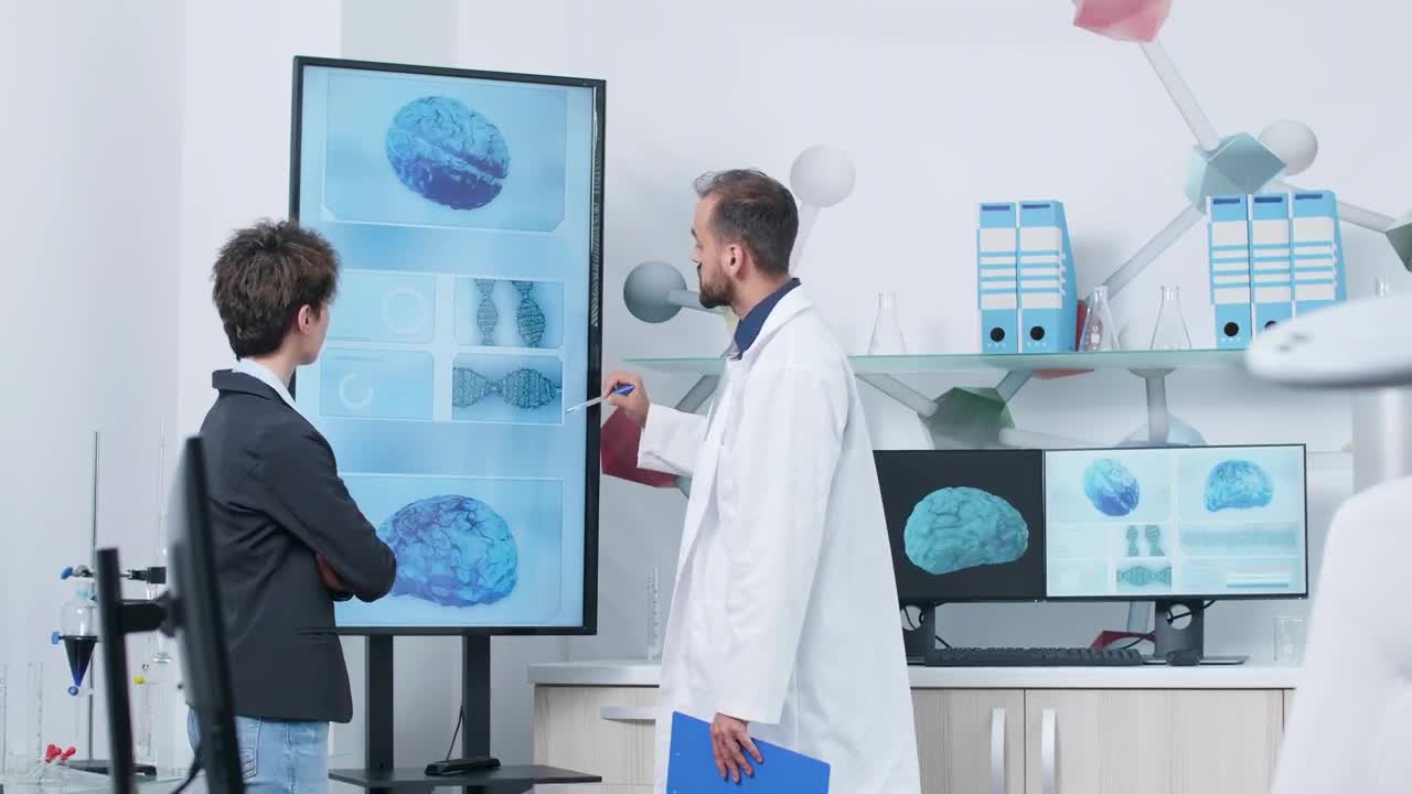 Stock Video Doctor And Scientist Look At D Brain Models In Modern Live Wallpaper For PC