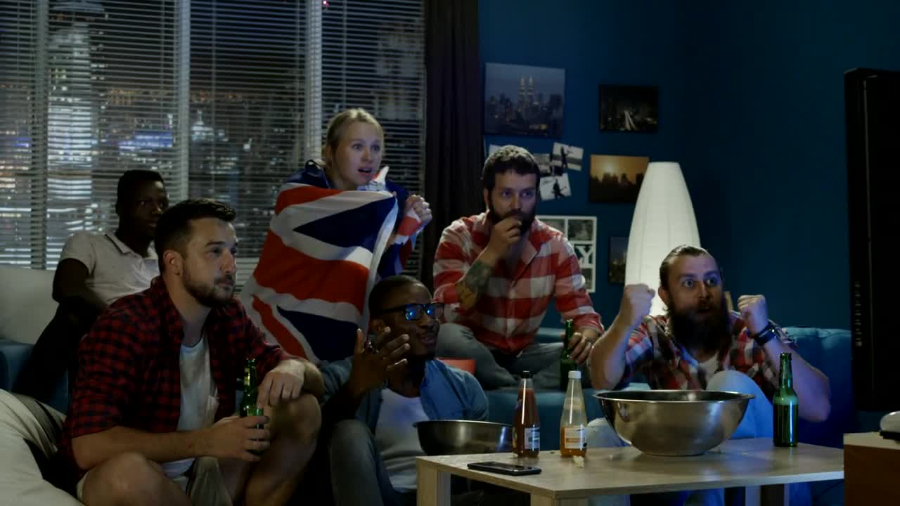 Stock Video Disappointed Fans Watching Sports On The Tv Live Wallpaper For PC