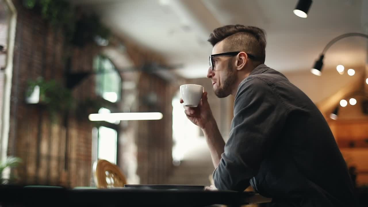 Stock Video Developer Types On Laptop In Cafe And Sips Coffee Live Wallpaper For PC