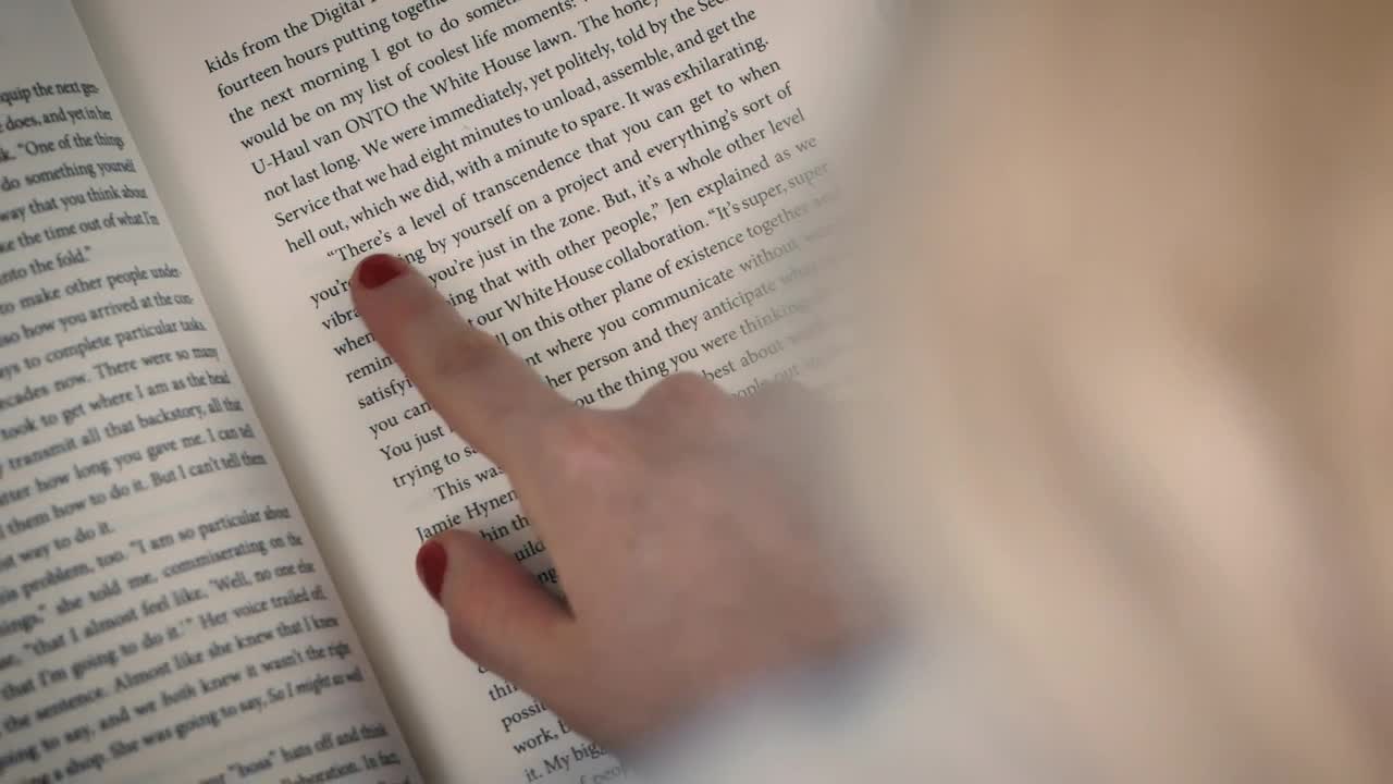 Stock Video Detailed View Of A Book Read By A Girl Live Wallpaper For PC