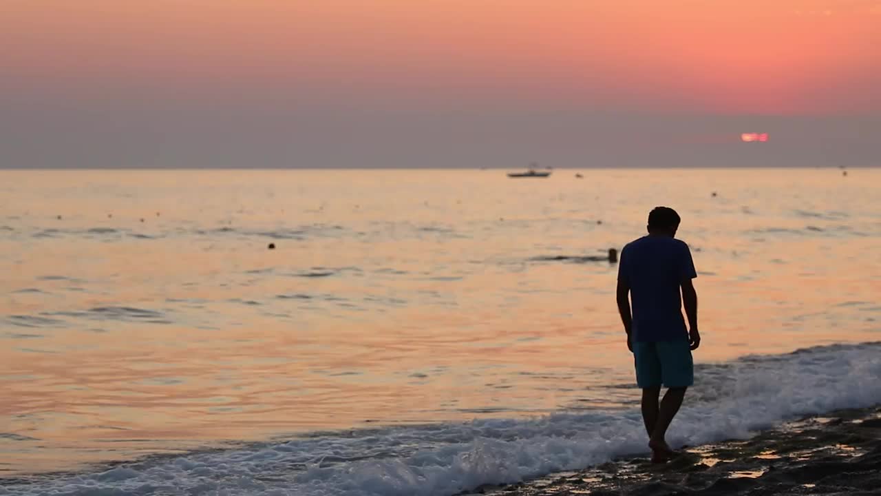 Stock Video Depressed Man In The Seashore At Sunset Live Wallpaper For PC