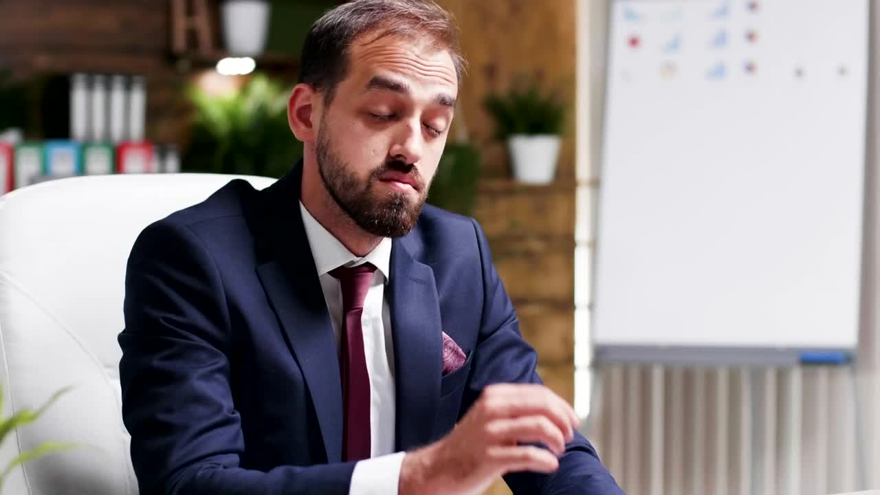 Stock Video Depressed Businessman Rubs Face And Looks At Report Live Wallpaper For PC