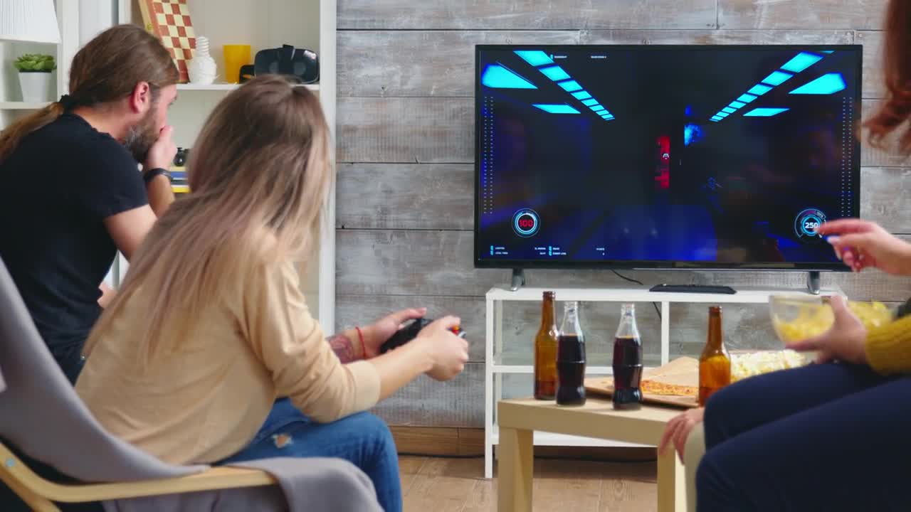 Stock Video Friends Enjoy Video Gaming On Sofa At Party Live Wallpaper For PC