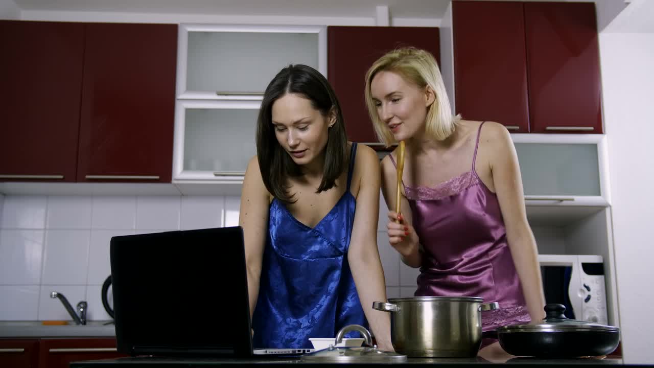 Stock Video Friends Cooking With The Help Of A Video Tutorial Live Wallpaper For PC