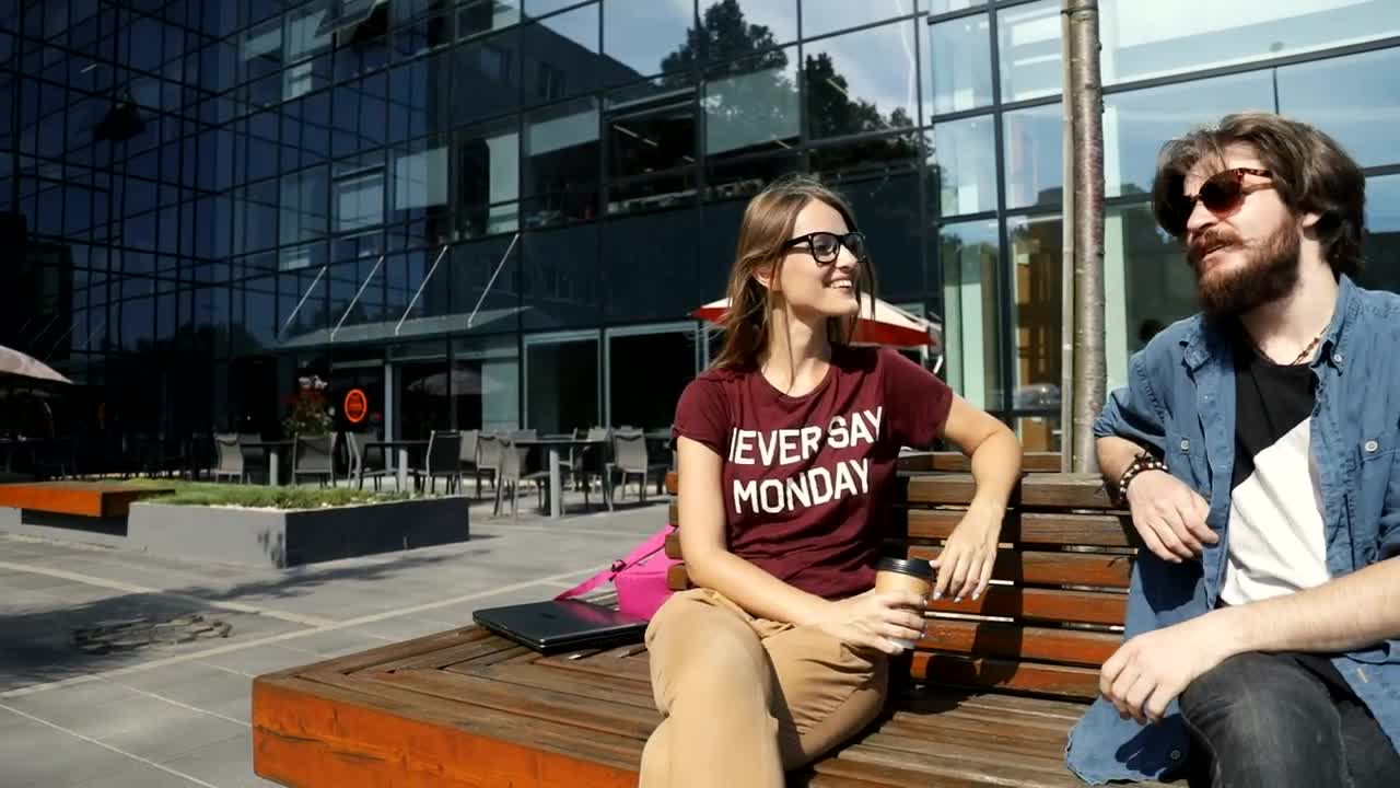 Stock Video Friends Chatting On A Bench In The City Live Wallpaper For PC