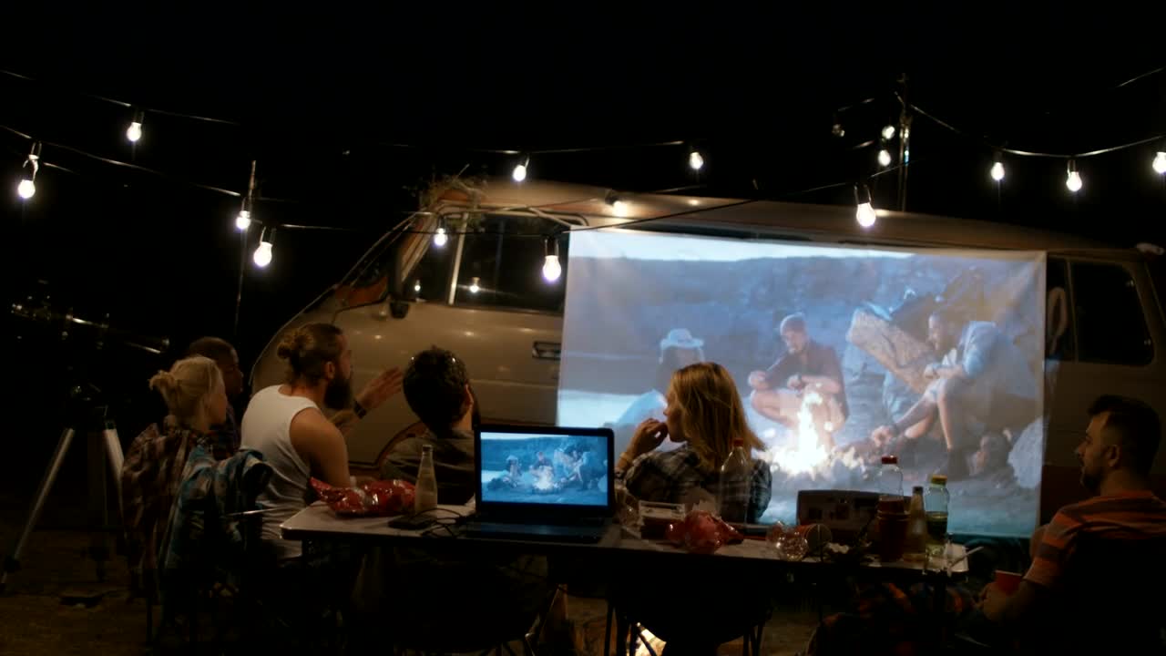 Stock Video Friends Camping Watching A Film On A Projector Live Wallpaper For PC