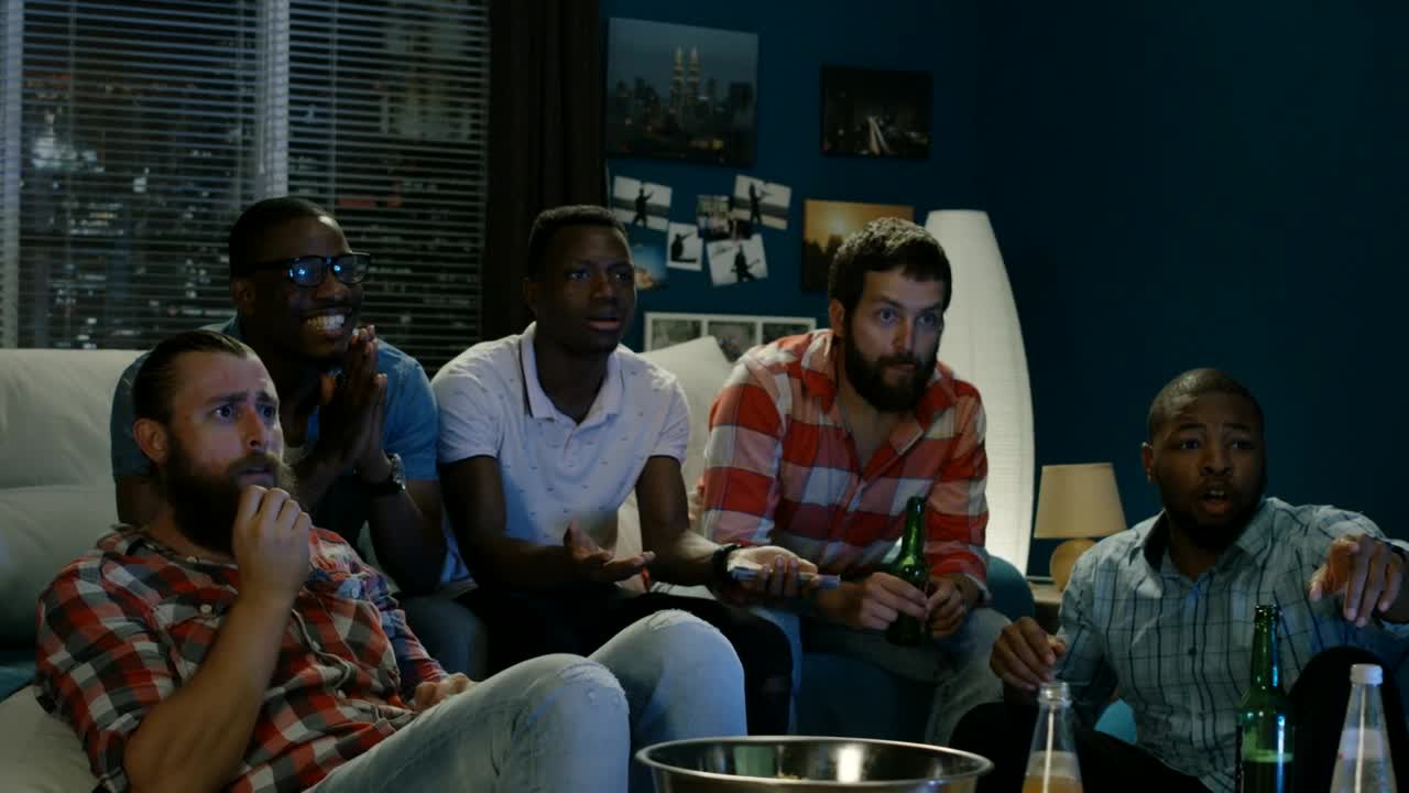 Stock Video Friends Betting For A Sports Game At Home Live Wallpaper For PC