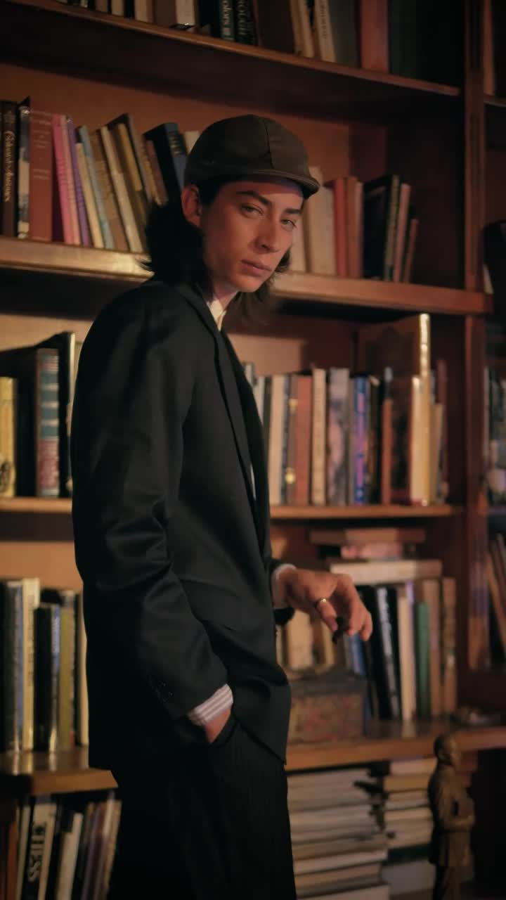 Stock Video Friendly Old Fashion Man Smoking A Cigar In A Bookstore Live Wallpaper For PC