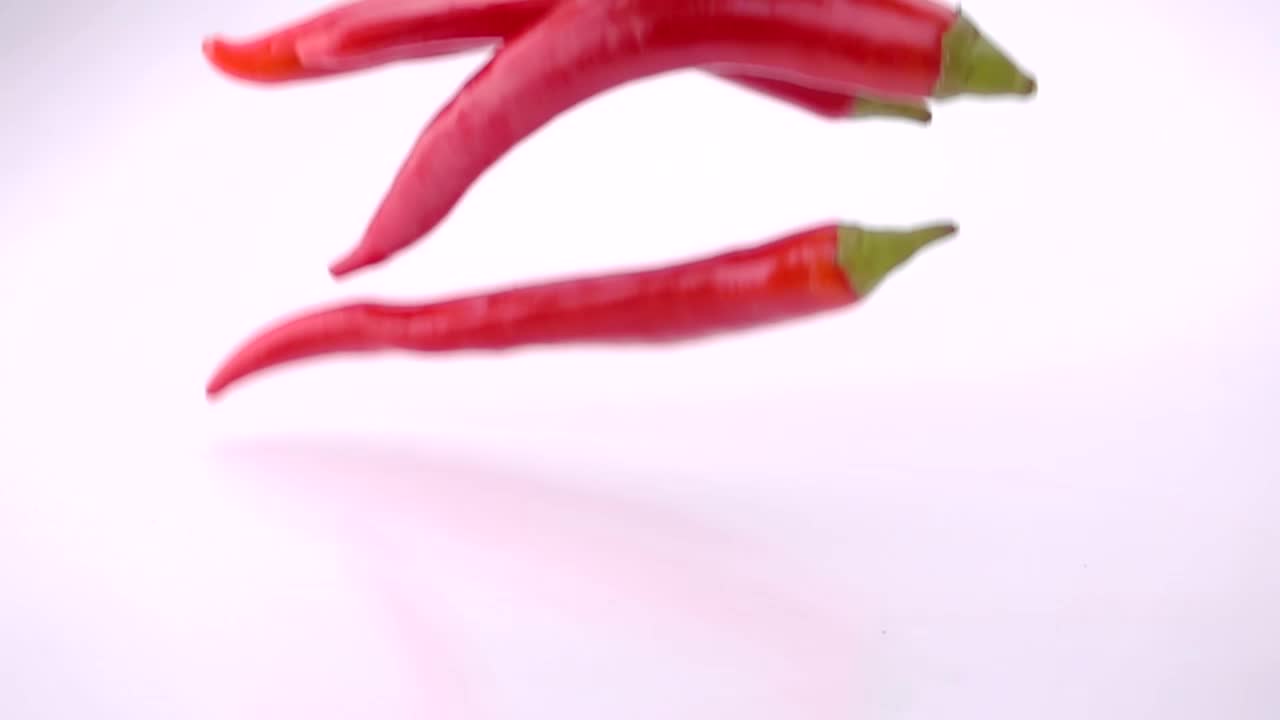 Stock Video Fresh Red Chili Peppers Falling Into Water Live Wallpaper For PC