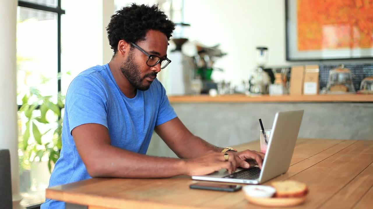 Stock Video Freelancer Working From A Small Coffee Shop Live Wallpaper For PC