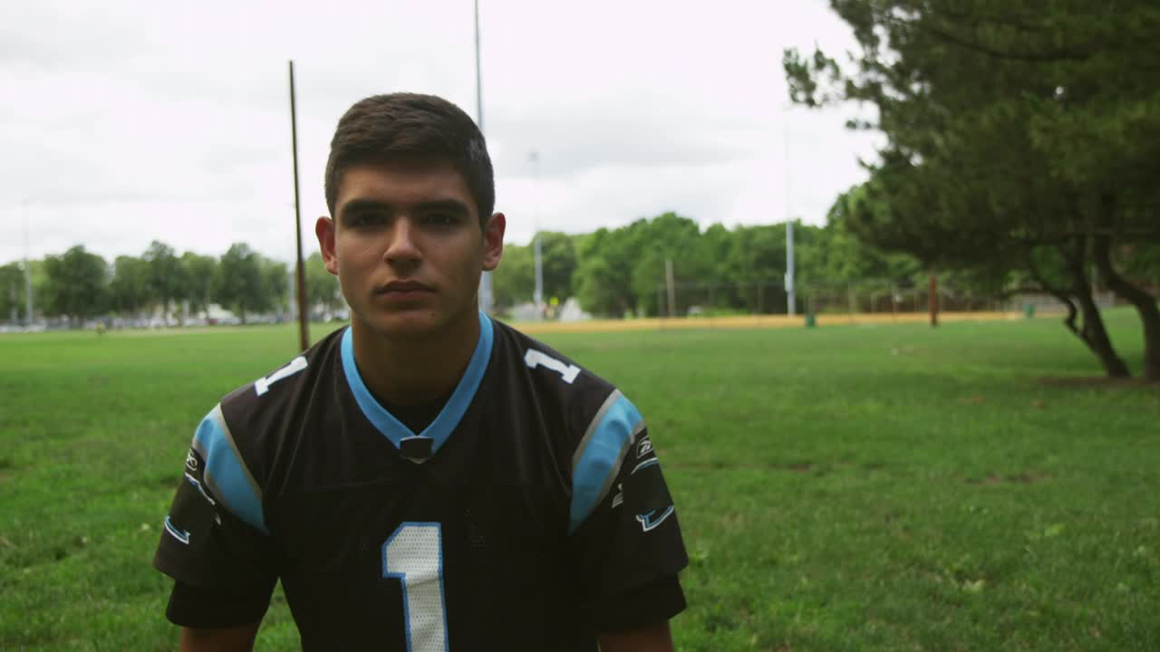 Stock Video Football Player Putting On A Helmet Live Wallpaper For PC
