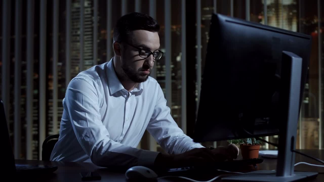 Stock Video Focused Businessman Working Late At Night Live Wallpaper For PC