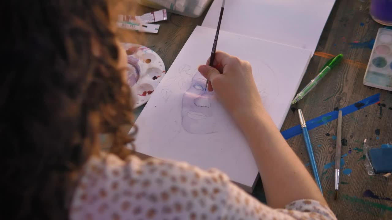 Stock Video Focus On The Hand Of An Artist Girl Painting With Live Wallpaper For PC