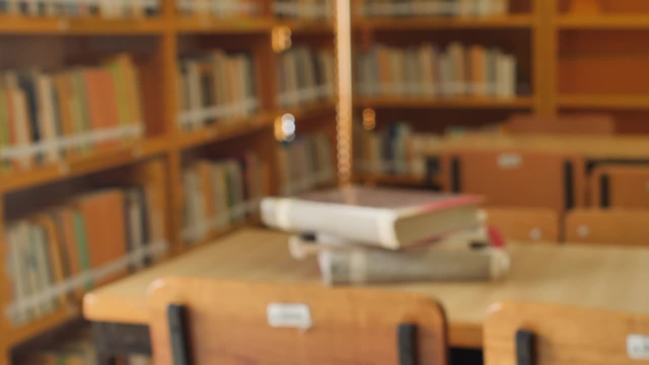 Stock Video Focus On A Stack Of Books In A Library Live Wallpaper For PC