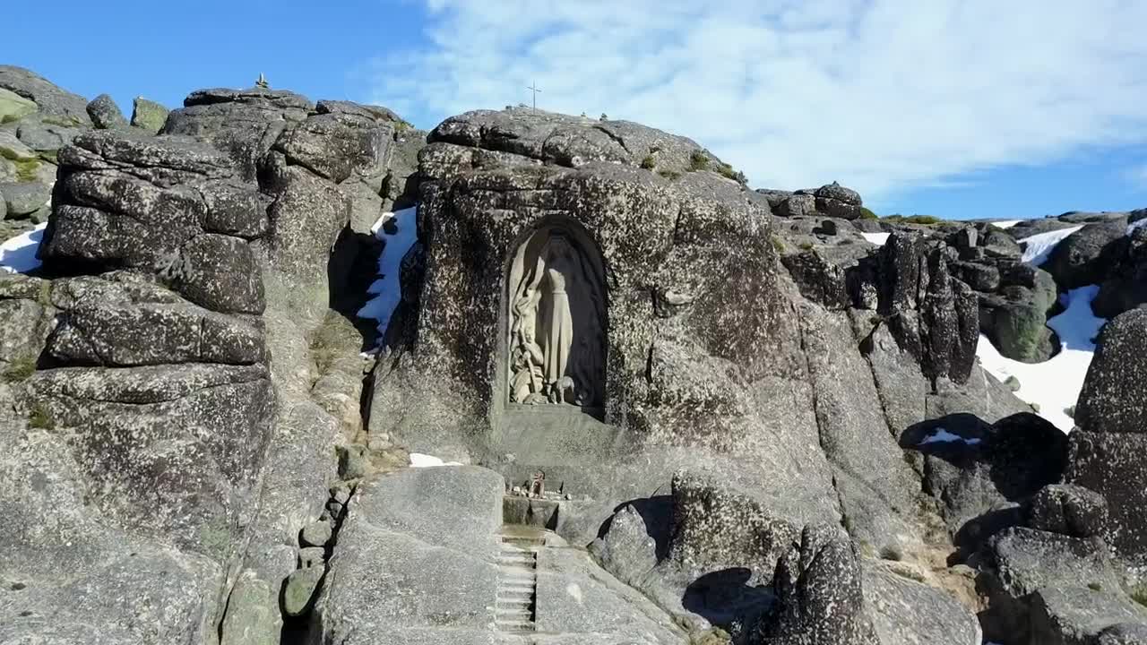 Stock Video Flying Towards A Statue Encrusted In The Rocks Live Wallpaper For PC