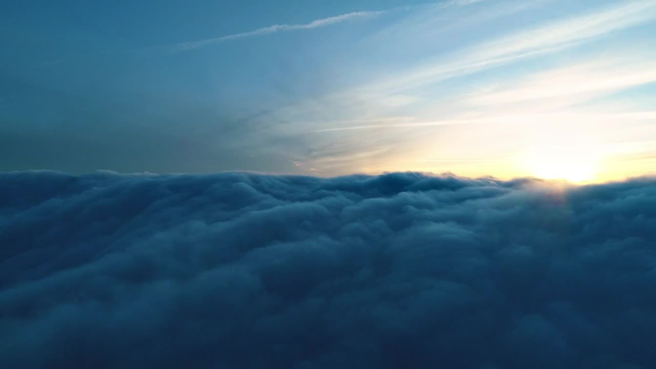 Stock Video Flying Over The Thick Clouds During Sunset Live Wallpaper For PC