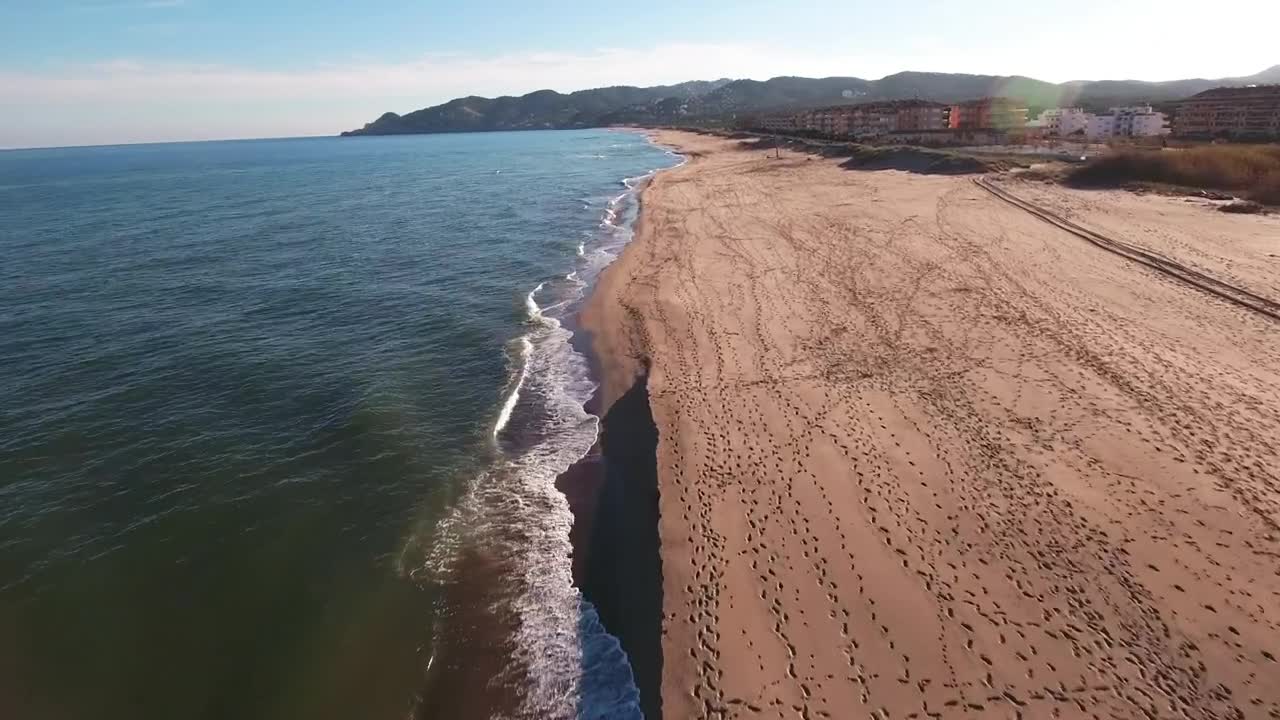 Stock Video Flying Over The Shore Of A Long Beach Live Wallpaper For PC