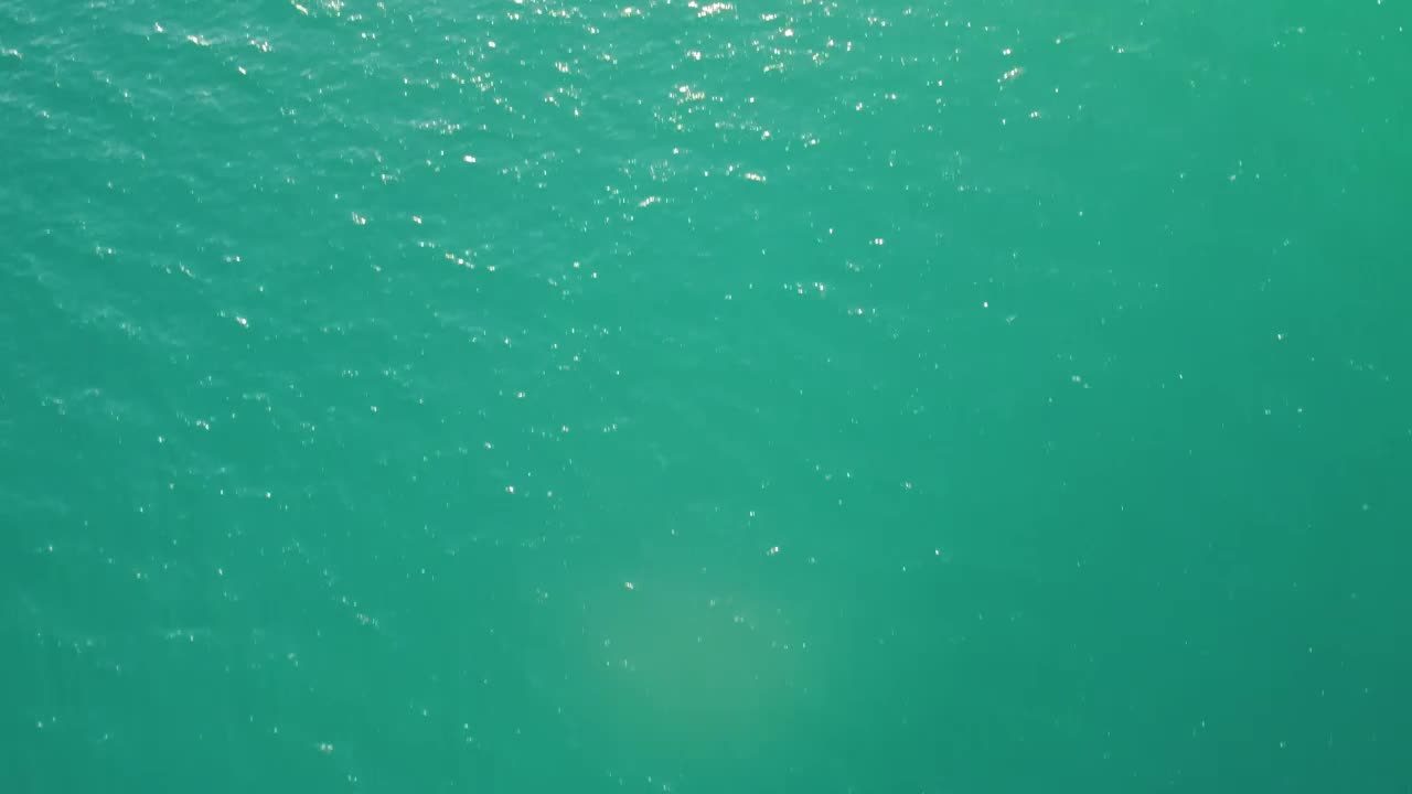 Stock Video Flying Over The Azure Blue Water Of A Beach Live Wallpaper For PC