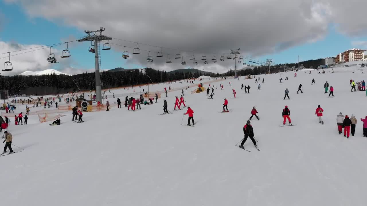 Stock Video Flying Over Skiers In The Snowy Mountain Live Wallpaper For PC