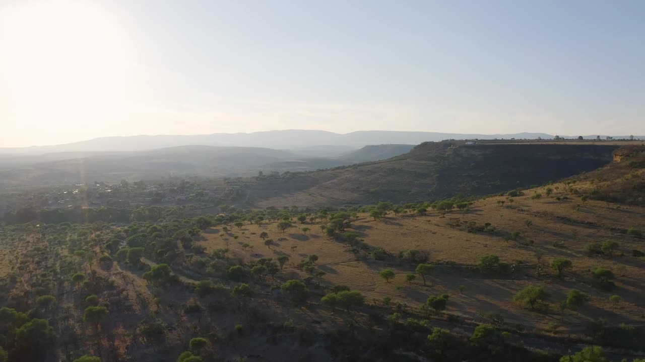 Stock Video Flying Over Mountain Ranges In The Warm Savanna Live Wallpaper For PC
