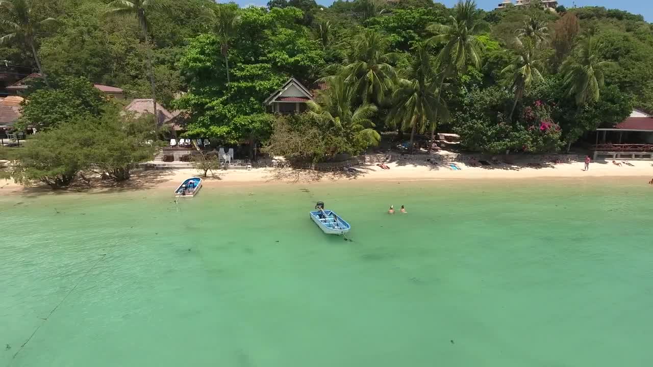 Stock Video Flying Over A Tourist Beach With Bungalows Live Wallpaper For PC