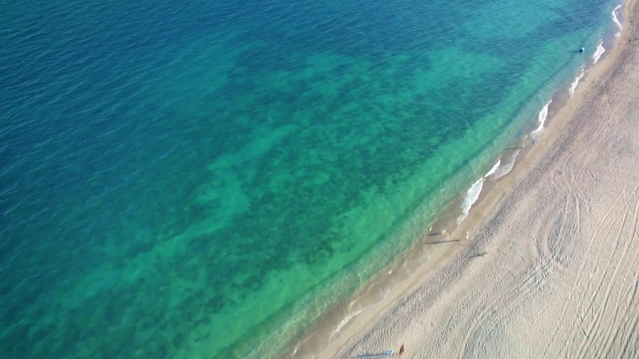 Stock Video Flying Over A Peaceful And Sunny Beach Live Wallpaper For PC