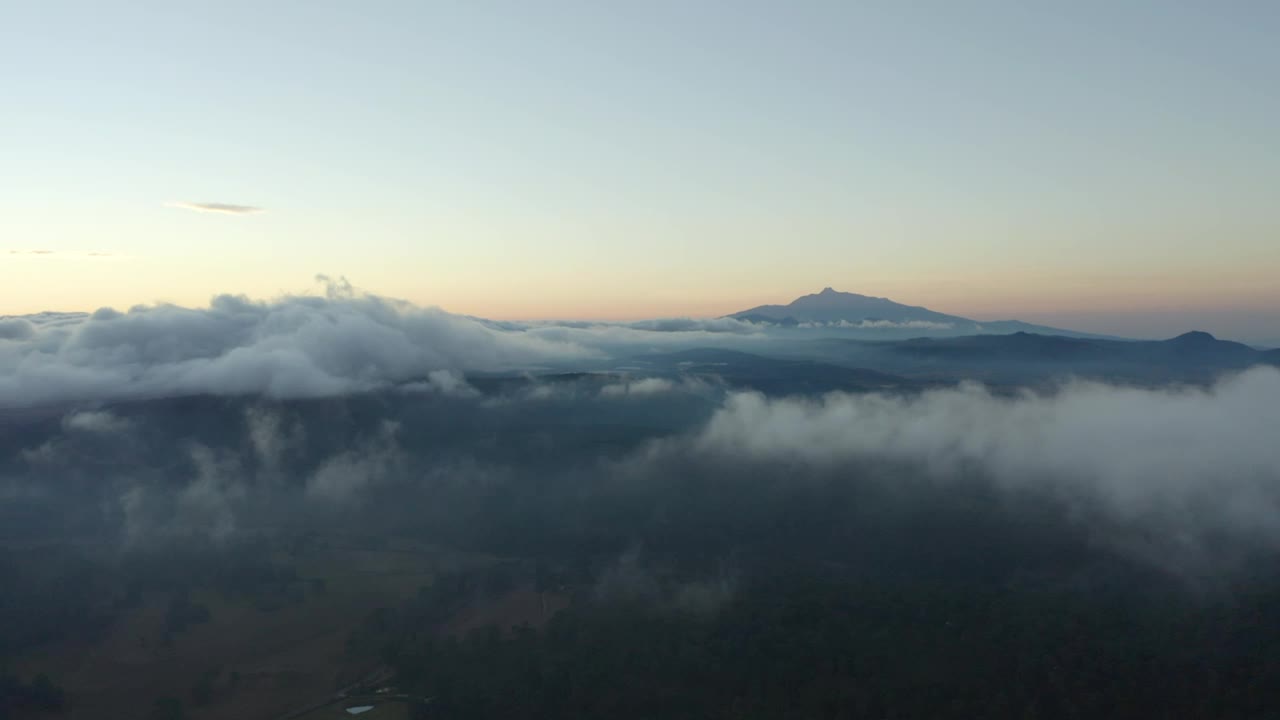 Stock Video Flying Over A Mountainous Landscape Covered With Clouds Live Wallpaper For PC