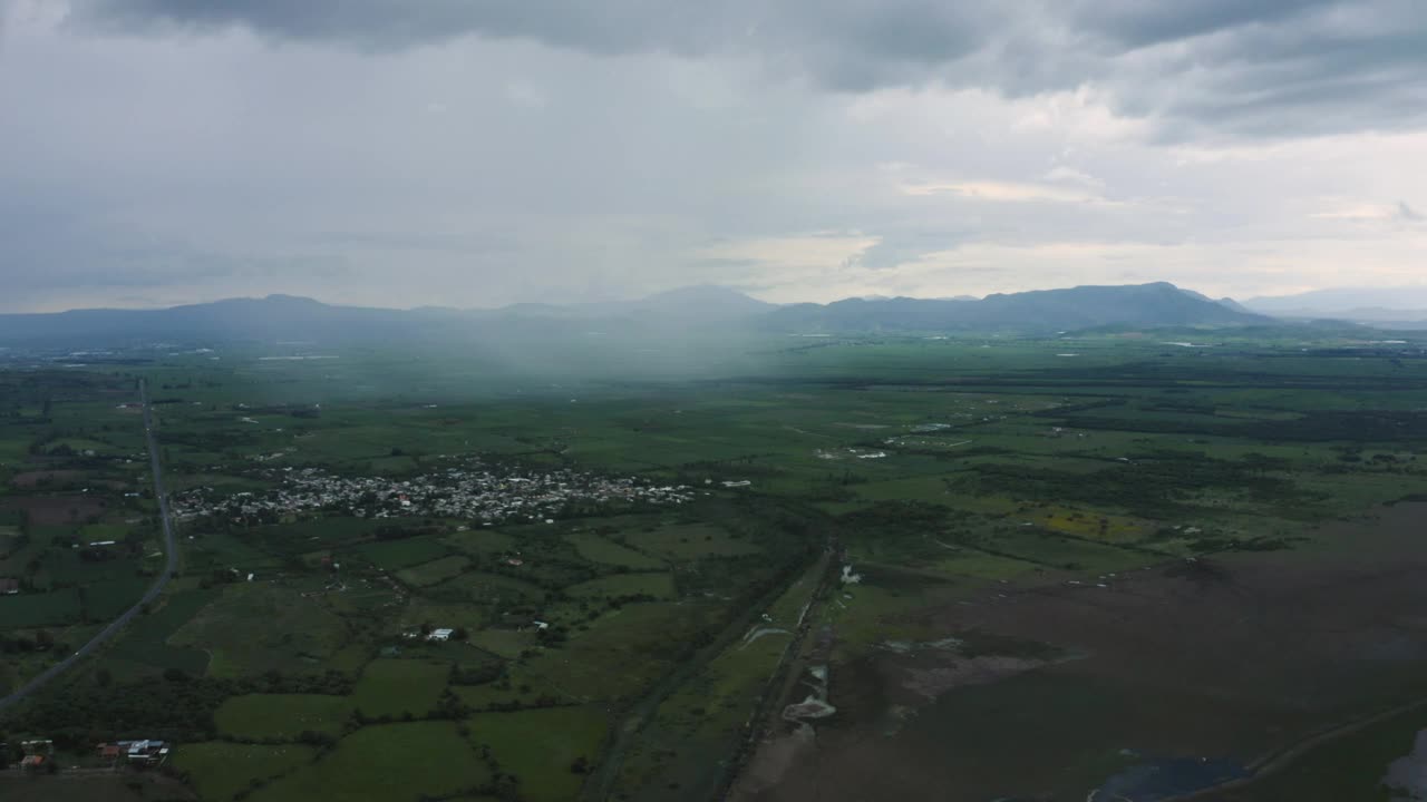 Stock Video Flying Over A Large Plain With A Town Plots And Live Wallpaper For PC