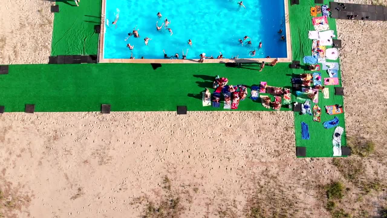 Stock Video Flying Over A Crowded Swimming Pool Live Wallpaper For PC