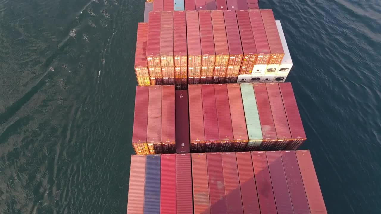 Stock Video Flying Over A Cargo Ship Leaving A Port Live Wallpaper For PC