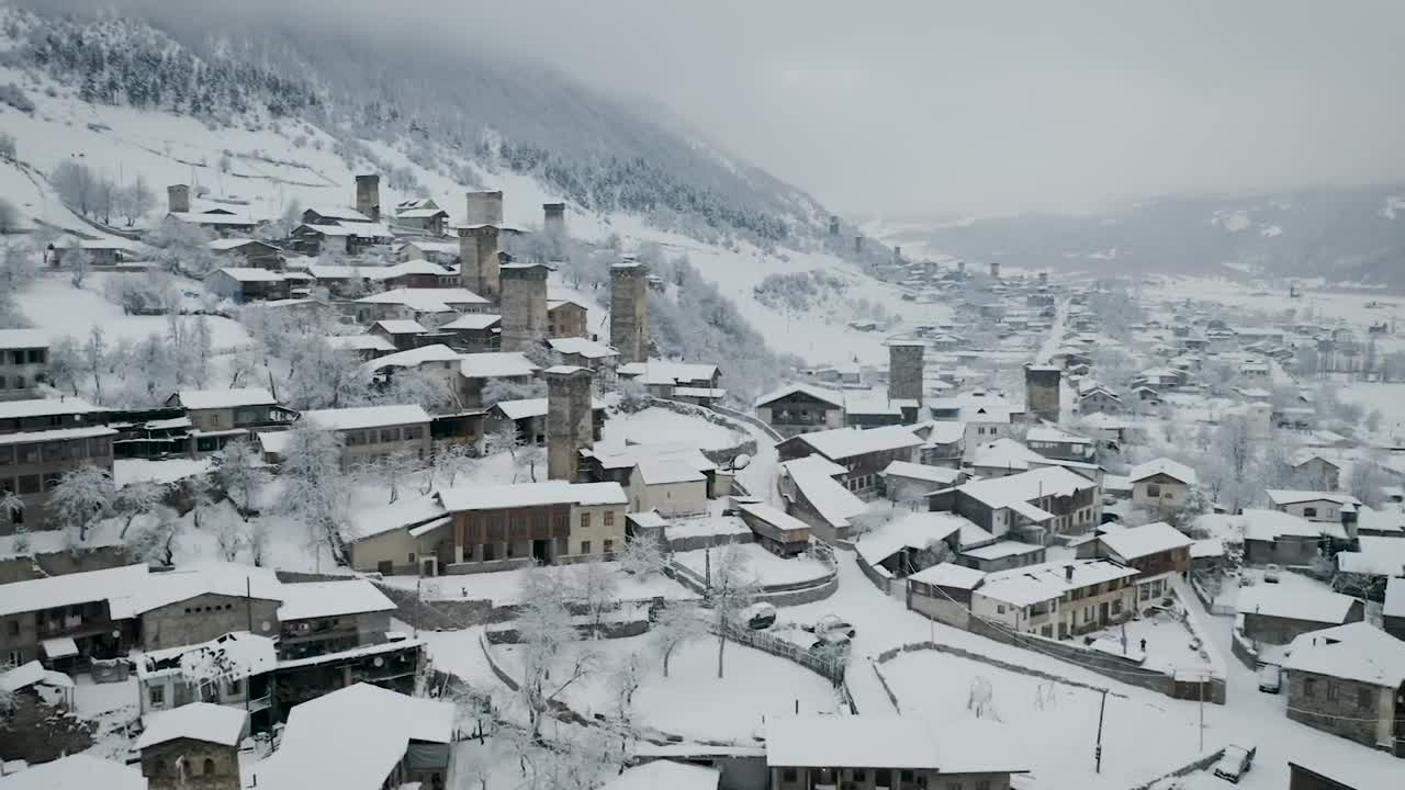 Stock Video Flying Above A Town With Old Towers Covered In Snow Live Wallpaper For PC