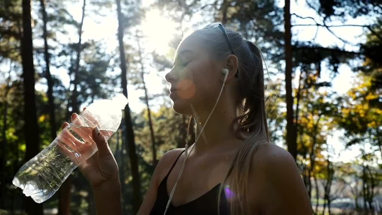 Stock Video Fitness Woman Drinking Water During Her Training Live Wallpaper For PC