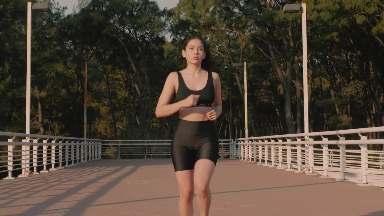 Stock Video Fit Woman From The Front Jogging Down The Street Live Wallpaper For PC