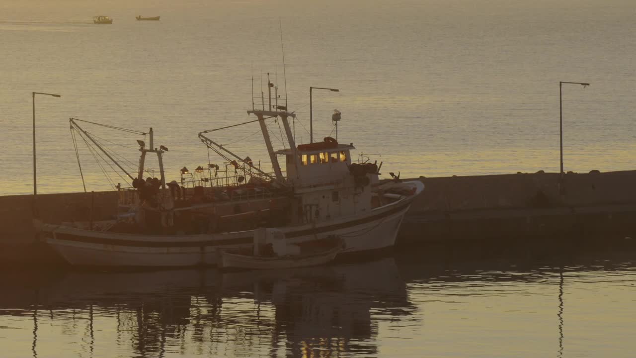 Stock Video Fishing Boat Anchored In A Harbor Town Live Wallpaper For PC